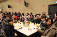 College students enjoying the Poon Choi at the Spring Feast